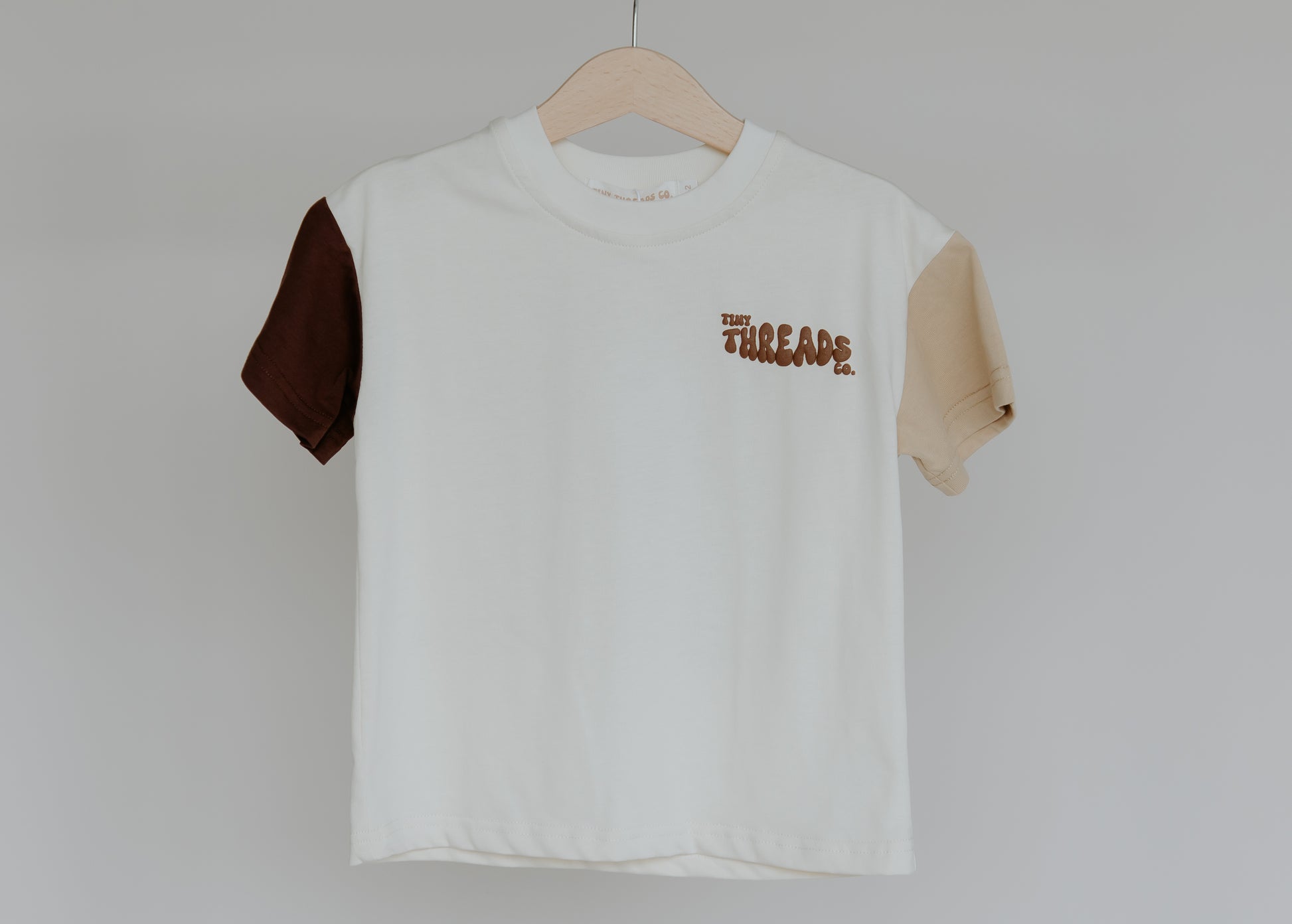 Tiny Threads Co. oversized short sleeve top in brown, front view