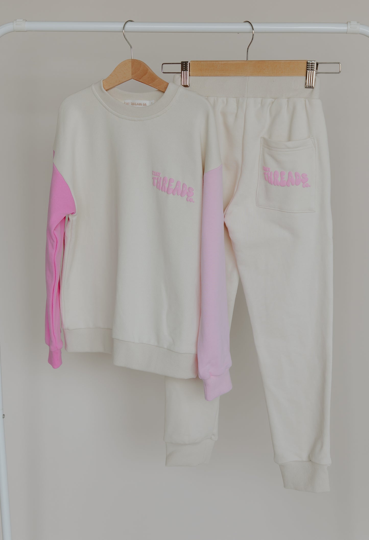 Tiny Threads Co. oversized long sleeve set in pink, front view of jumper, rear view of pants