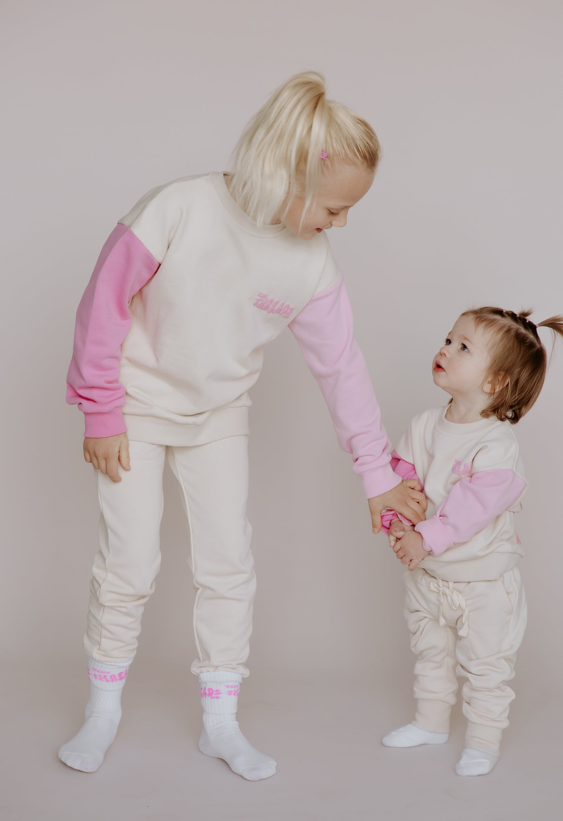 Tiny Threads Co. oversized long sleeve sets in pink, worn by Z aged 7 and I aged 18 months