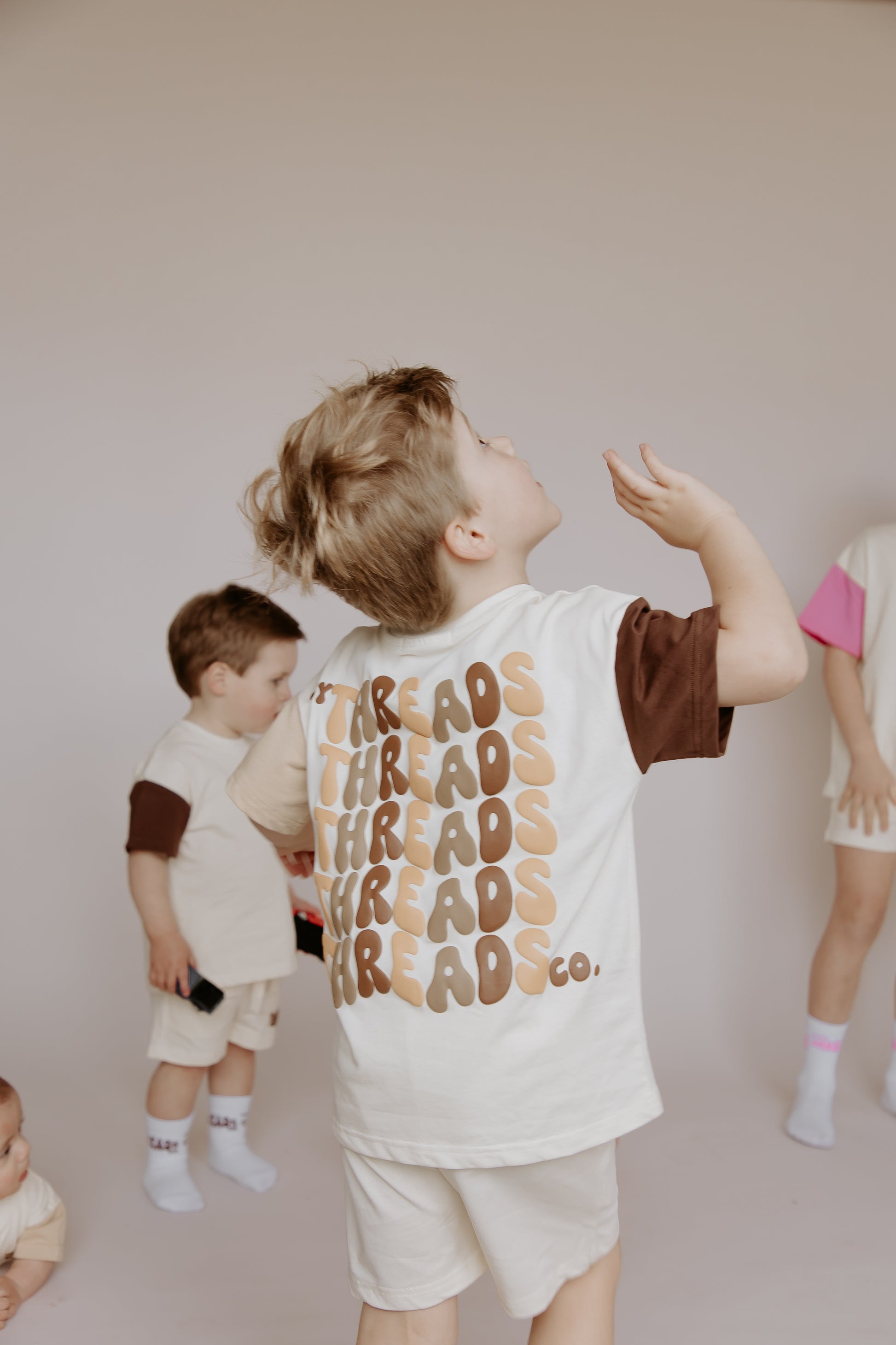 Tiny Threads Co. oversized short sleeve set in brown, worn by L aged 4.5 years