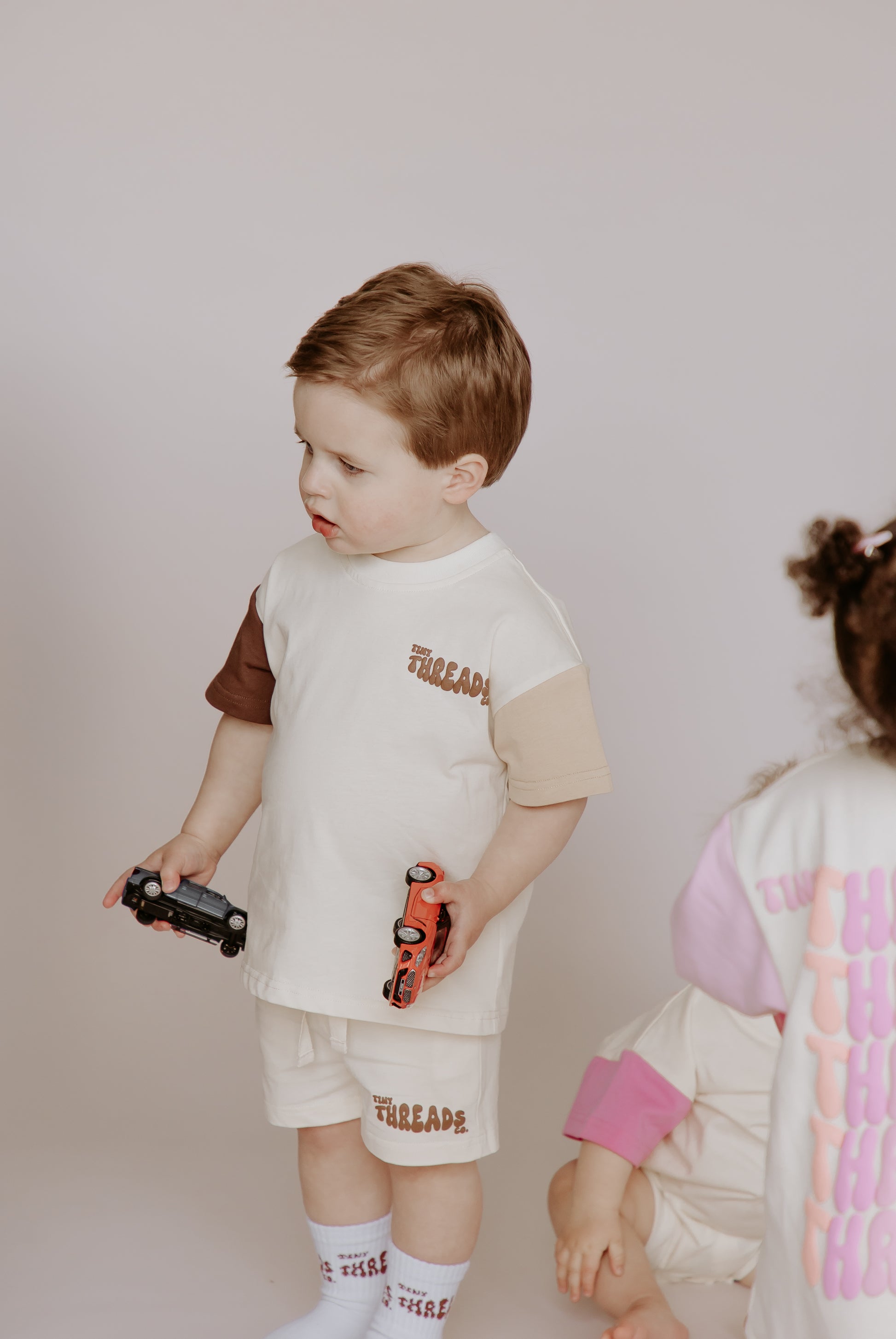 Tiny Threads Co. oversized short sleeve set in brown, worn by H aged 22 months