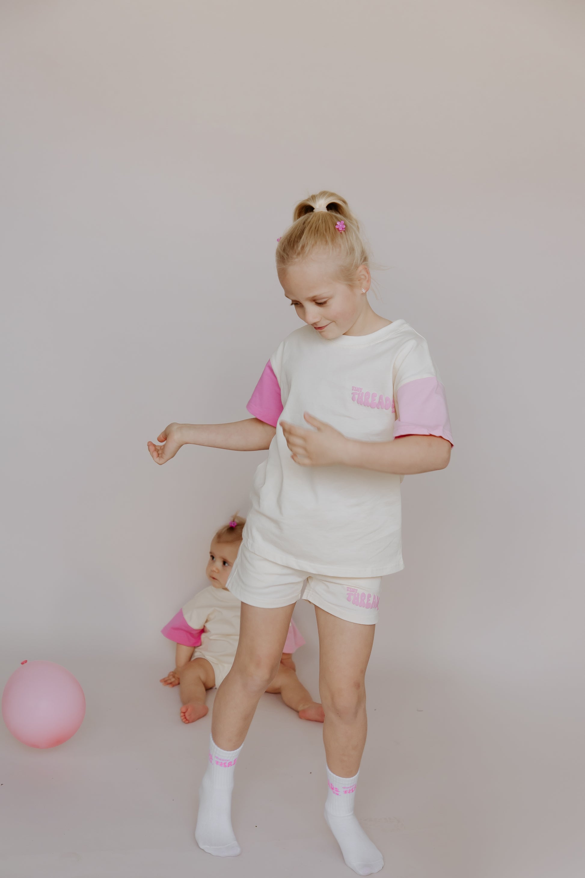 Tiny Threads Co. oversized short sleeve set in pink, worn by Z aged 7